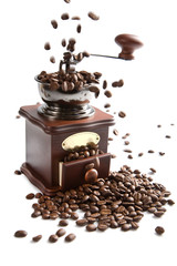 coffee beans falling into grinder isolated