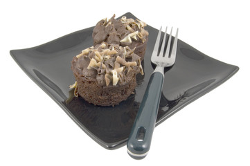 chocolate cakes on plate with fork isolated on white