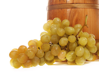 Barrel with white grapes