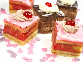Delicious cakes on white background