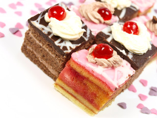 Delicious cake with chocolate and sweet hearts