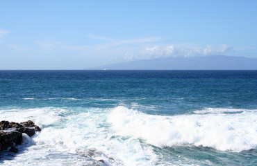 Beach on Tenerife. Black volcanic rocks and waves.