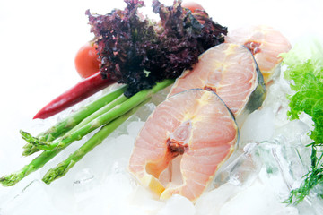 Fresh sturgeon slices decorated on white background