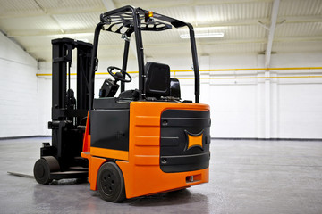 Fork Lift Truck in empty Warehouse