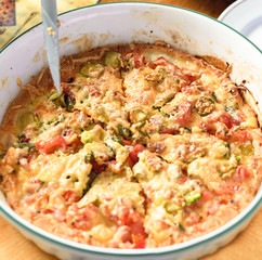 a pizza with tomatoes and cheese