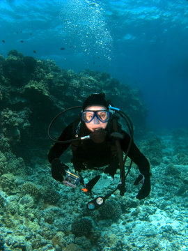 Scuba Diver looking into the Camera in Hawaii