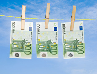 banknotes drying  on rope after laundry
