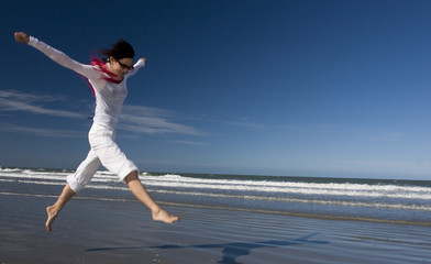 Fototapeta na wymiar Jump at beach