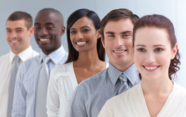 Business team in a line. Focus on an attractive man