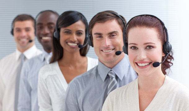 Beautiful businesswoman working in a call center in a line