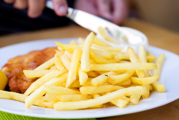 Plate of fries and schnitzel restaurant