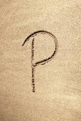 Alphabet letter P handwritten in sand