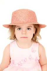 Portrait of young girl in pink princess dress and hat