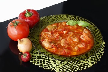 sausages cookked with paprica,tomatoes and onions