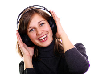 Isolated smiling young girl listening to music