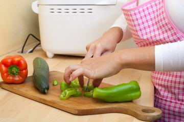 woman cutting vegetables