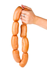 Hand holding sausages chain