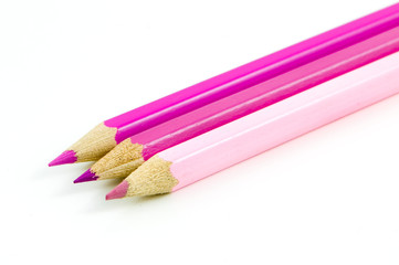 Three pink pencils