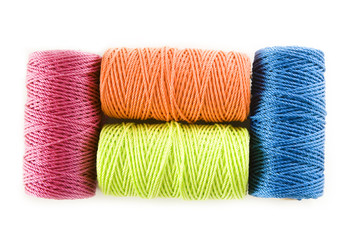 four colorful  cord  spools