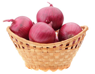 red onion bulbs in basket isolated on white