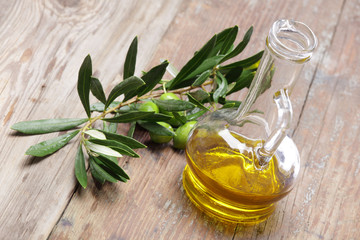 Olive oil with olive branch