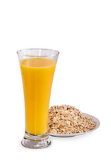 Glass of orange juice and flakes on the white
