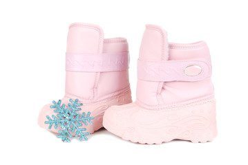 Pink children snow boots and snowflake