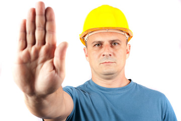 Blue collar worker making a stop sign