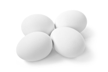 4 white eggs isolated