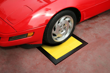Front tire of red car