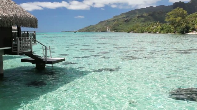 Over water bungalow with steps into amazing lagoon
