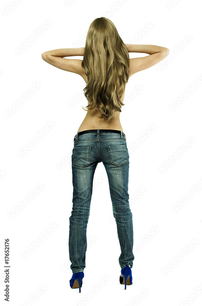 Wall mural Young sensual woman in jeans