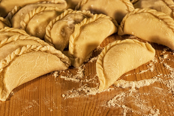 dumplings on the table with flour
