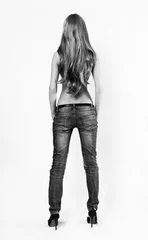 Fotobehang Young sensual woman in jeans © Egor Mayer