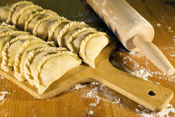 dumplings on the table with flour