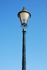 Fototapeta na wymiar Vintage lamp post (blue sky background)