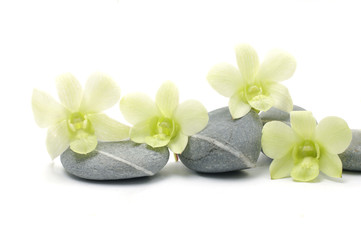 Spa essentials pyramid of stones with orchid