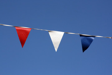 Close up of bunting hanging on Broadstairs seafront, Kent