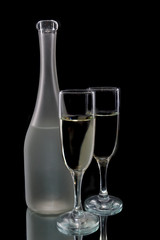 Pair of wine flutes and bottle