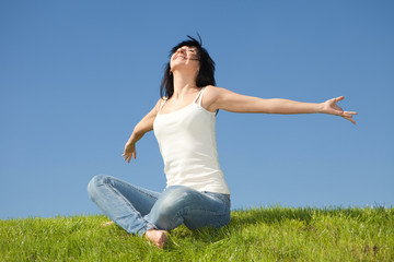 Fototapeta premium happy young woman dreams to fly on winds
