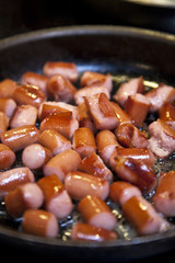 Frying sausages