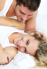 Fototapeta na wymiar Couple lying in bed