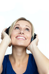 Happy woman listening to music on headphones