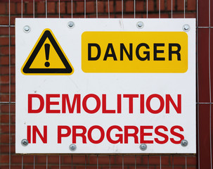 Danger sign on a construction fence