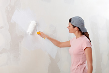 Young woman decorate her new apartment