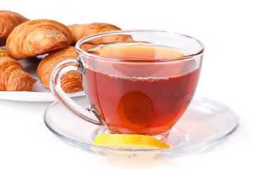Fresh croissant and cup of tea