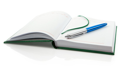 blank notebook with  pen isolated on white