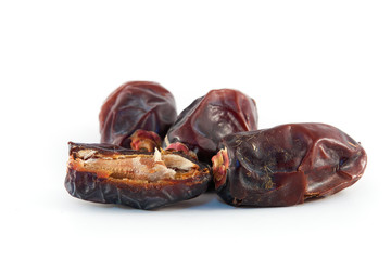 Dates fruit in wicker basket on white background