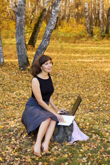 Young businesswoman working on nature.