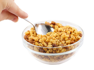 Glass bowl of cold cereal flakes.Isolated